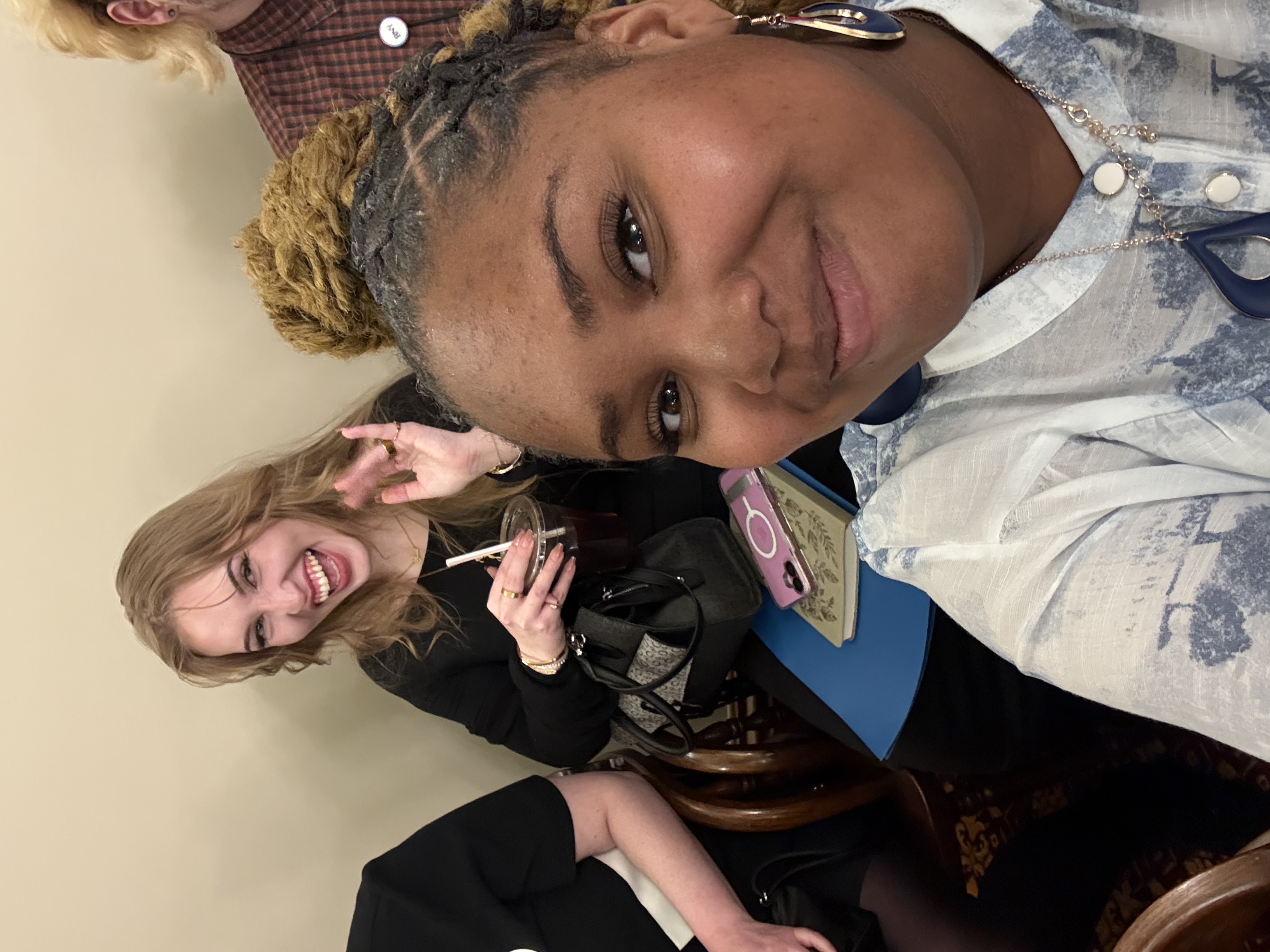 Two youth advocates sharing a moment together during a Michigan Senate visit